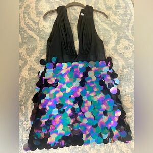 Gorgeous dress, black with deep plunge and large sequence below waist. Size XS